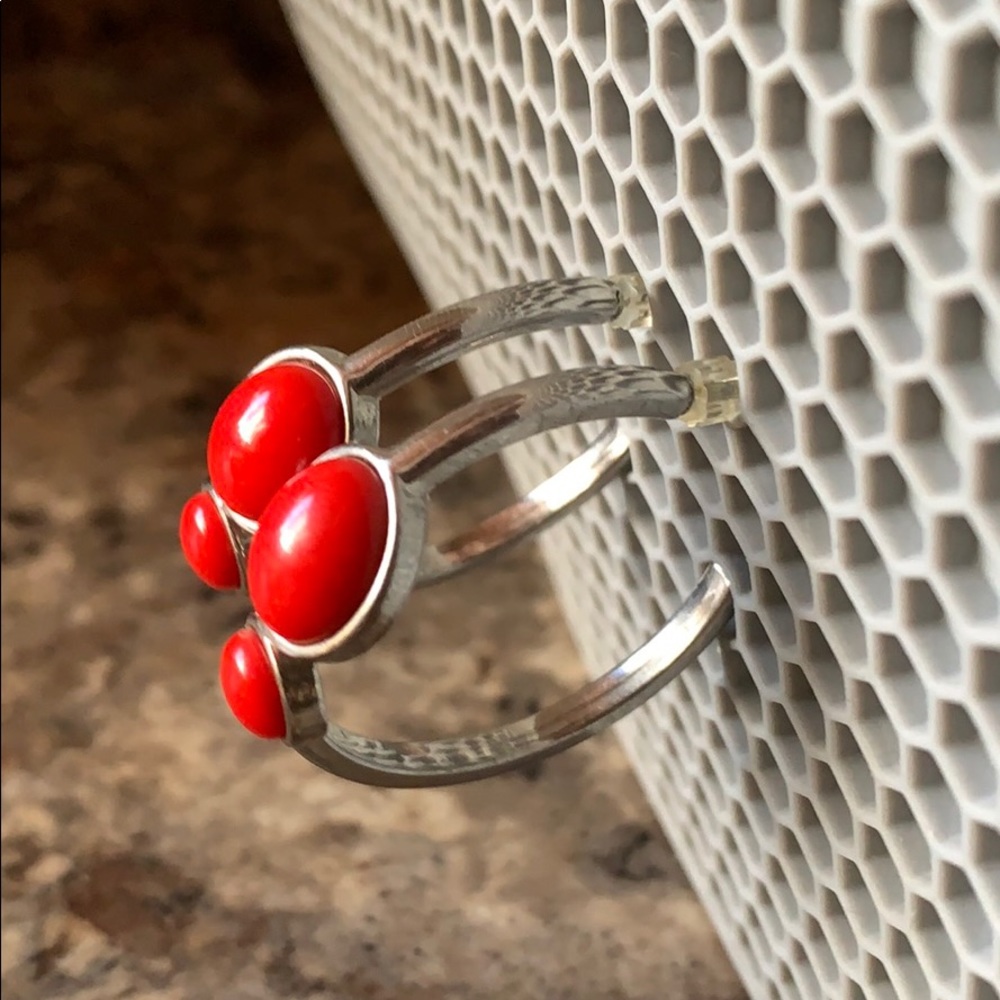 Silver hoop earrings with red stones. WHBM